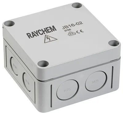 Beige coloured junction box with cutouts around the side for cable entry and Raychem logo printed on top.